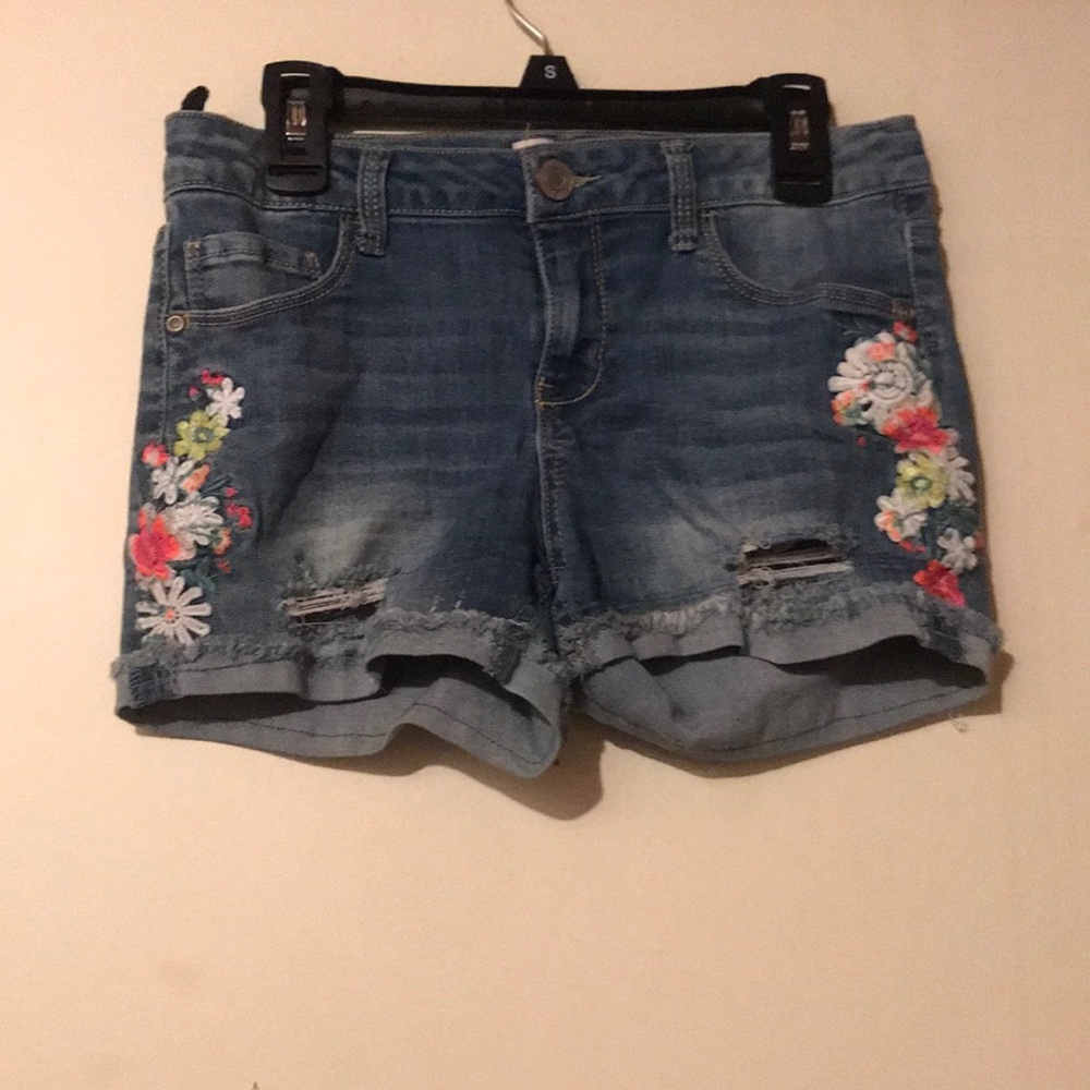 Jean shorts with flowers.
